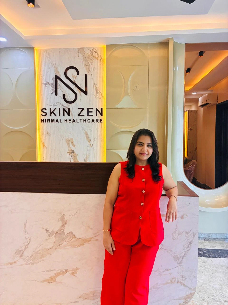 Dr Astha Gupta in red at Skinzen